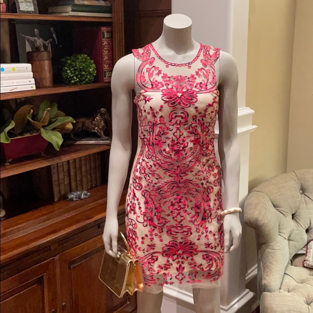 Red and cream appliqué dress with diamond closure